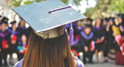 Person in graduation cap.
